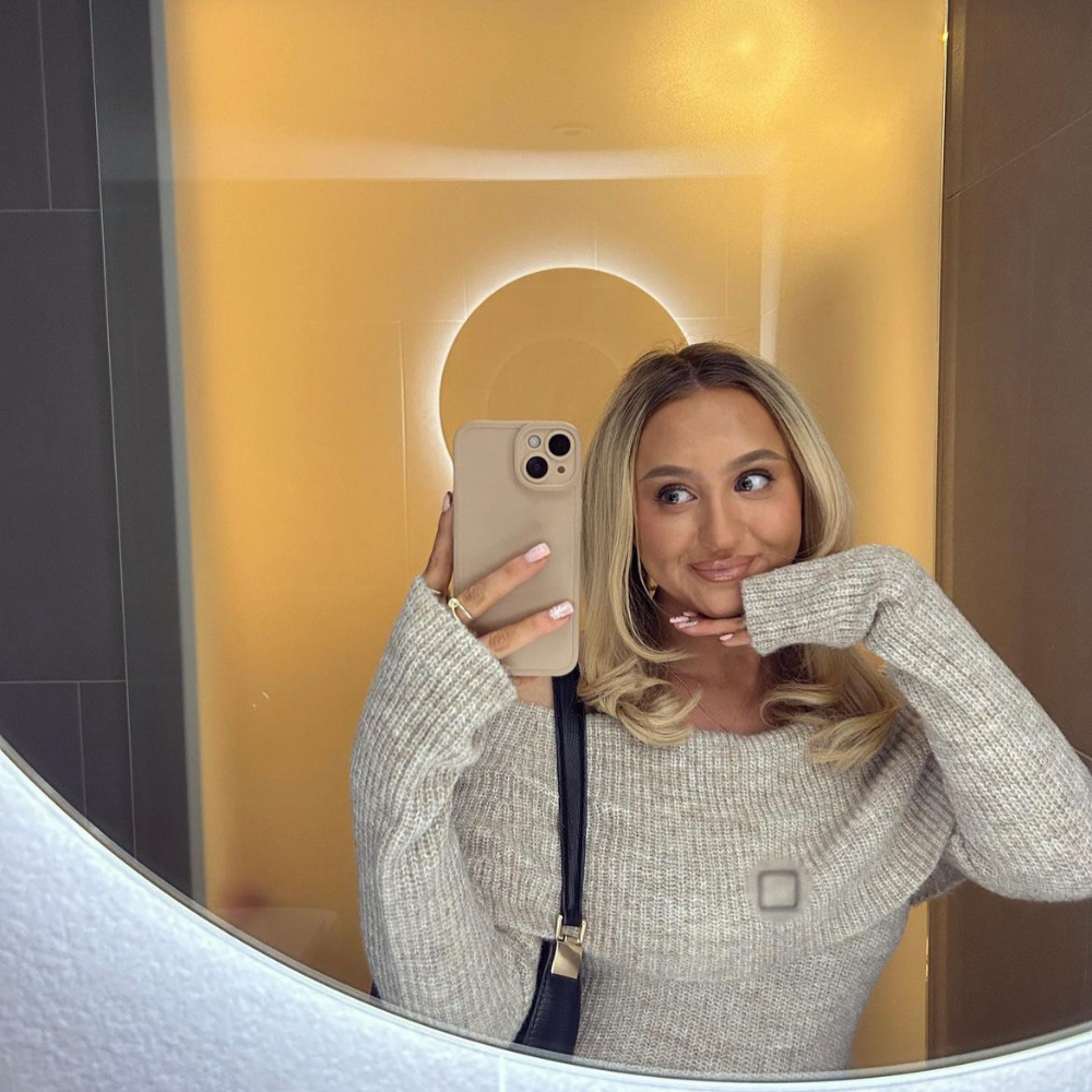 girl holding phone case