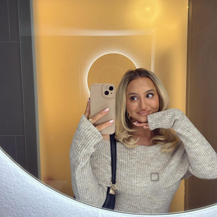 girl holding phone case