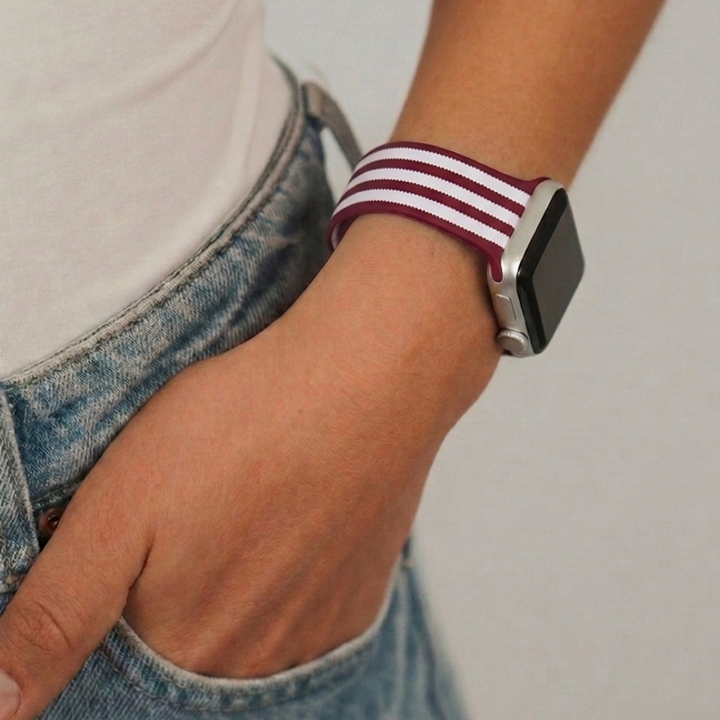 Close up image studio shoot wearing blushberry scallop stripes watch strap
