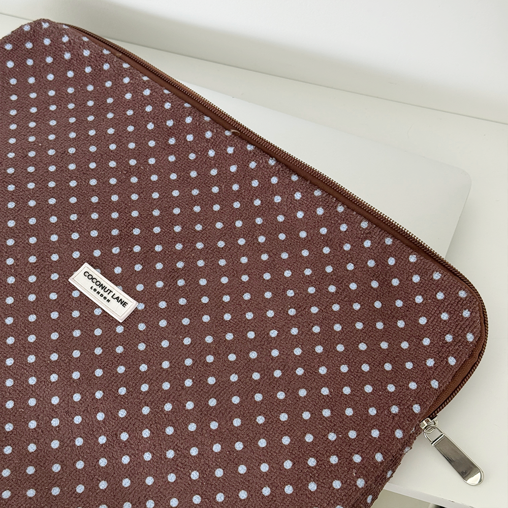 Brown and blue polka dot design Laptop Sleeve with silver zip and Coconut Lane logo badge.