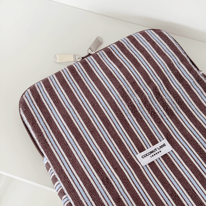 Brown, white and blue striped iPad Sleeve with silver zip and Coconut Lane logo badge.