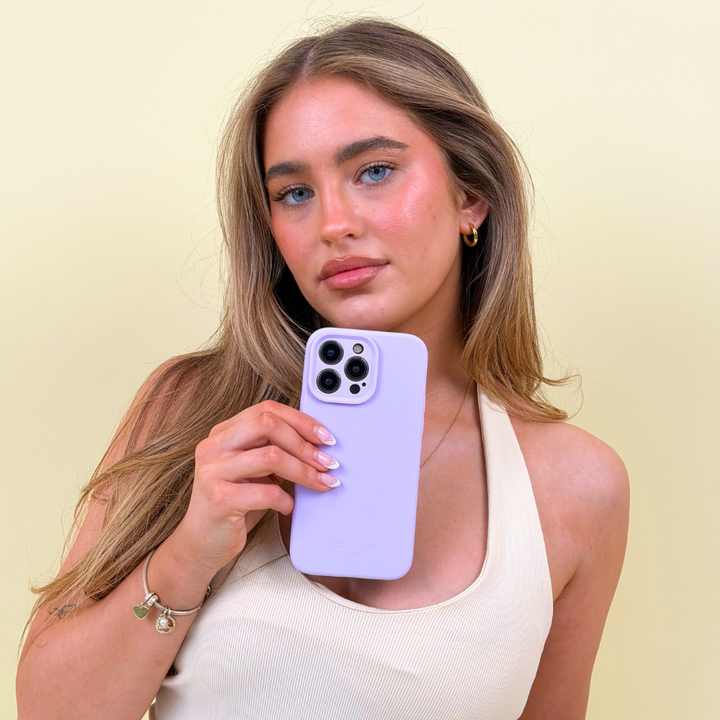Girl posing with her butter soft lilac silicone phone case