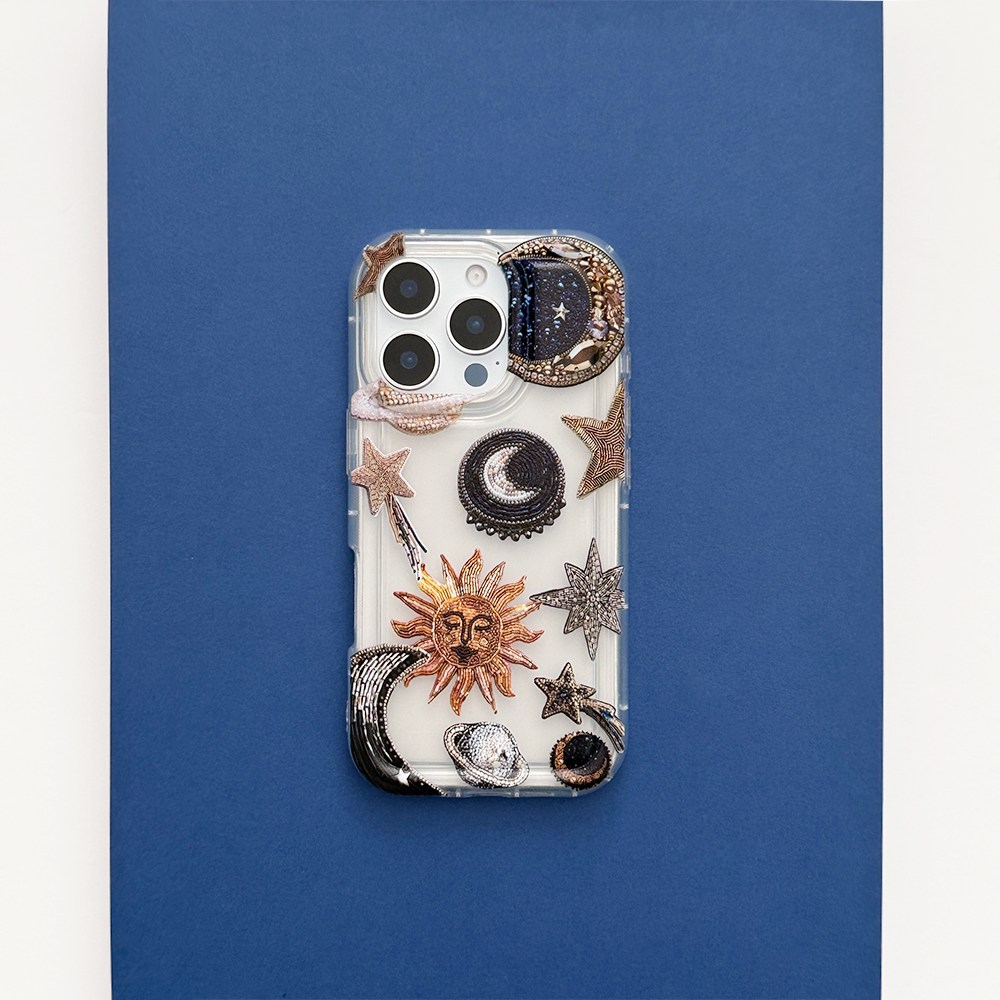 Clear phone case with blue background and celestial-themed cosmic designs by Coconut Lane.