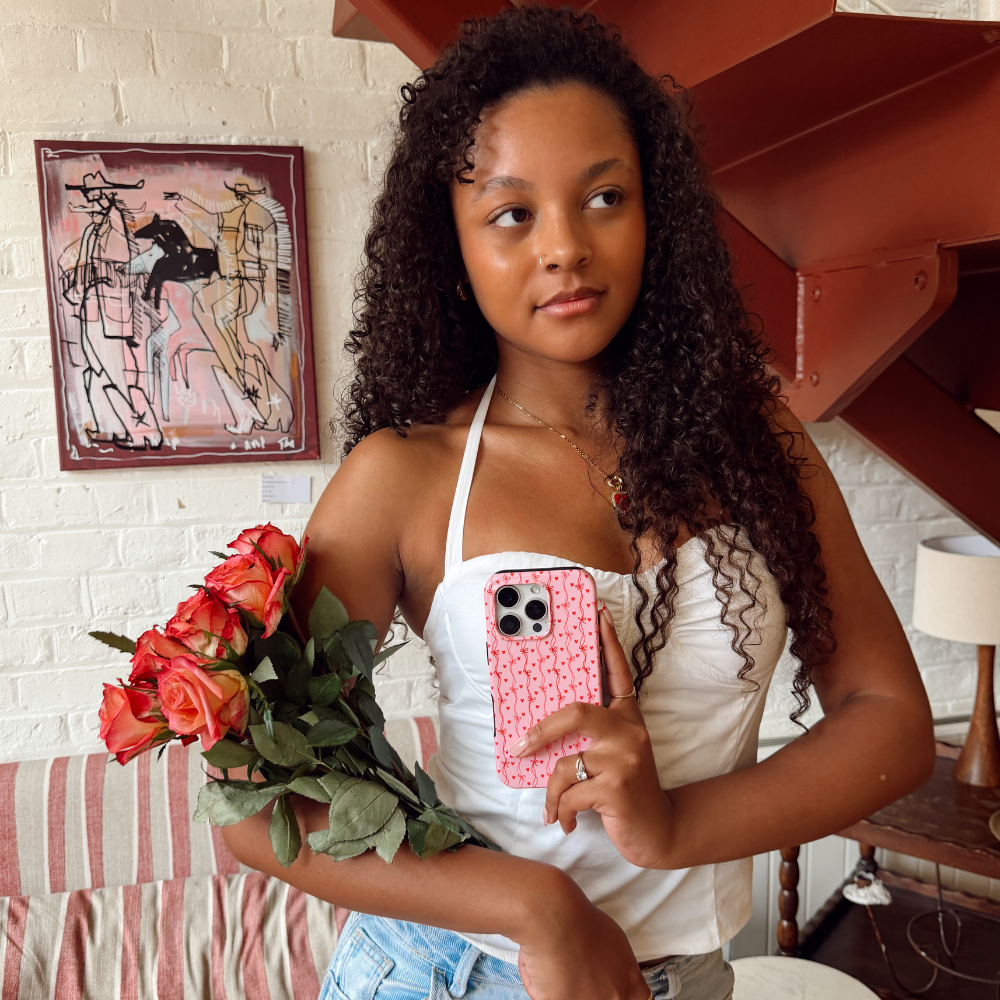 Girl holding Love Tied Phone Case with Flowers