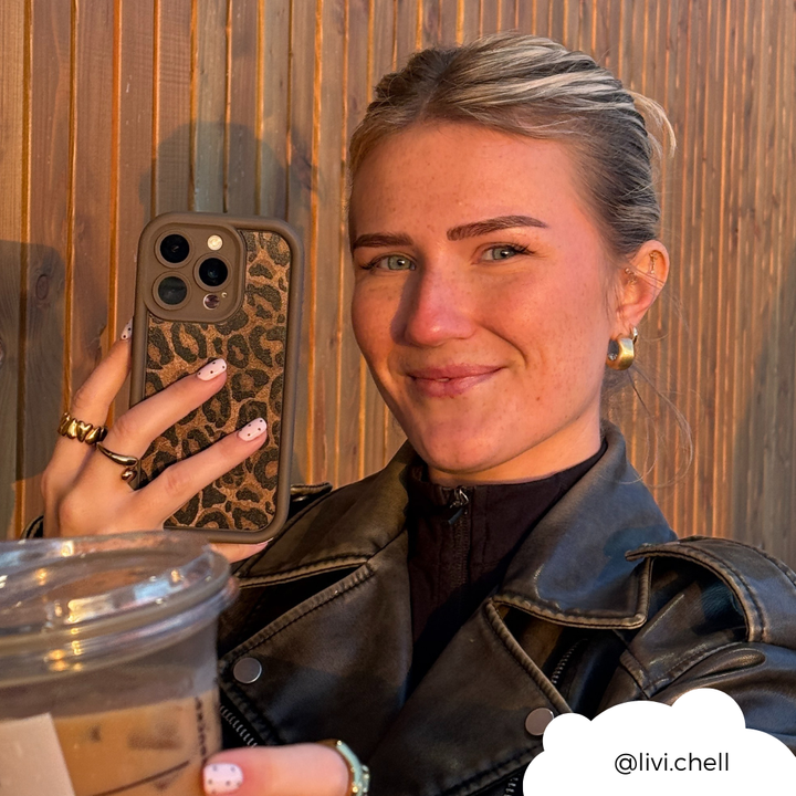 Girl cheersing coffee with mocha leopard phone case in hand