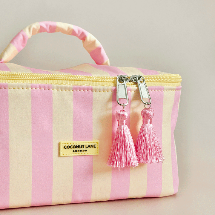 Yellow and pink stripe Vanity Case, with tassels and padded handle.