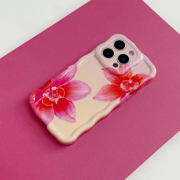 Pink and peach ombre Wavy Coconut Lane Phone Case with bright pink flower design.