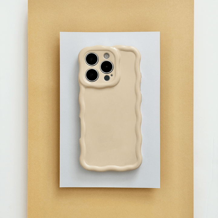 Plain yellow peach coloured Phone Case with wavy edge effect.