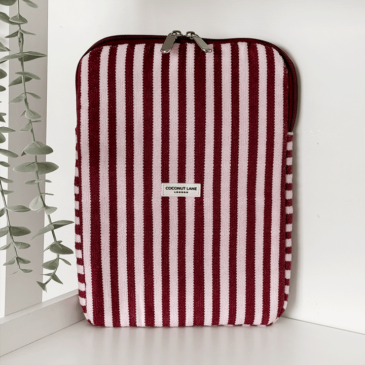 Burgundy and light pink striped iPad Sleeve, with silver zip and Coconut Lane logo badge.